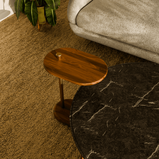 Luxury handcrafted wooden side table with brass detail, styled in a living room setting.