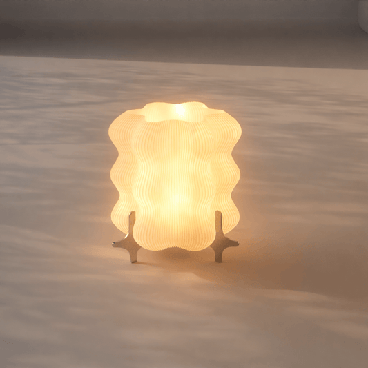 Designer AURA table lamp by Nata Lia with warm diffused glow