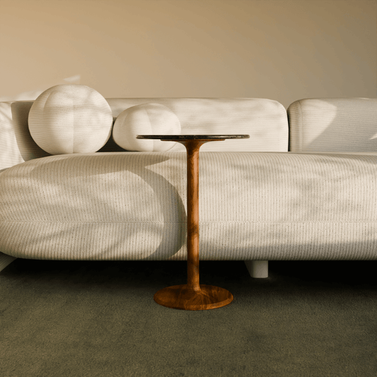 Teak wood pedestal base of Luna Side Table on neutral flooring