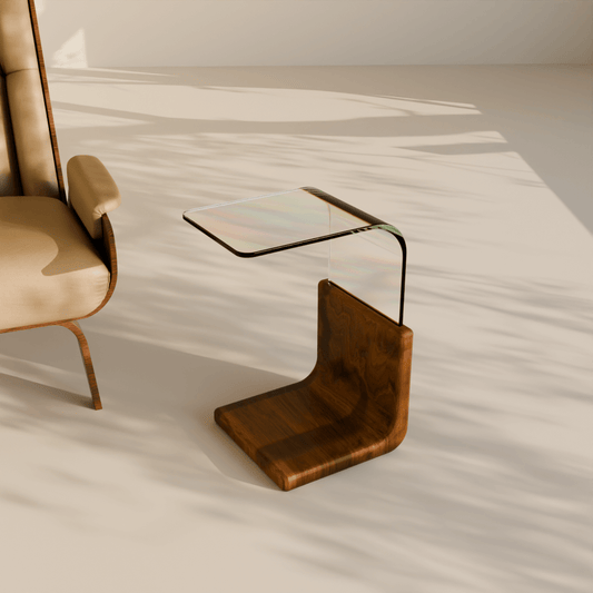 Linea Side Table – Modern teak wood and bent glass side table beside beige accent chair in a minimal living room